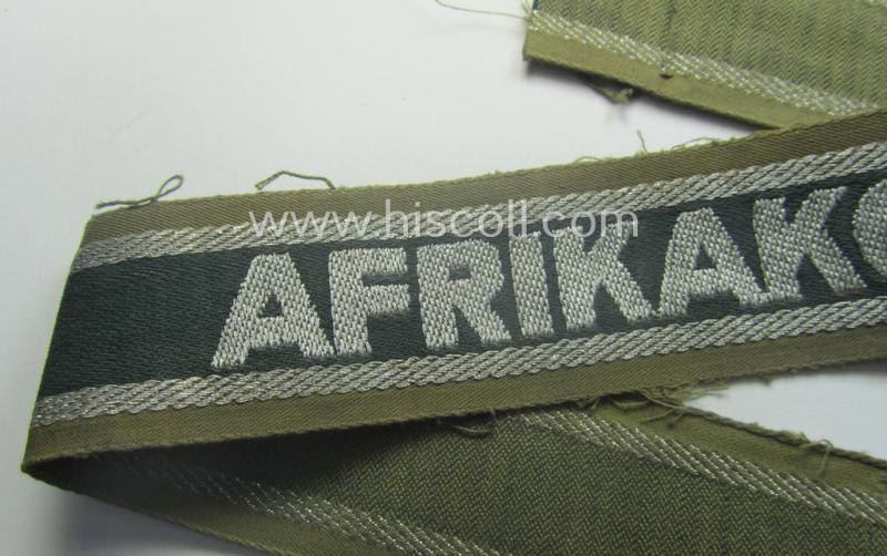 Truly worn, 'BeVo'-like cuff-title (ie. 'Ärmelstreifen') entitled: 'Afrikakorps' being a with certainty issued example that comes in an overall nice- (ie. hardly shortened- and/or once tunic-attached-), condition