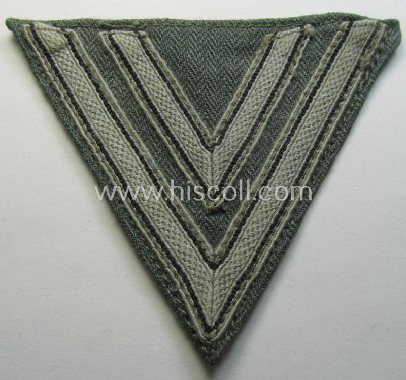 Neat, WH (Heeres ie. Waffen-SS) 'Armwinkel' (or: arm-chevron) as was executed on a greenish-coloured- and/or 'HBT'-like (ie. 'Drillich'-) based background as was specifically intended for usage by an: 'Obergefreiter' (ie. 'SS-Rottenführer')