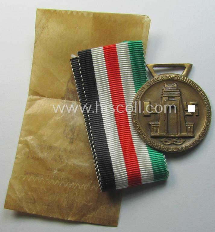 Stonemint medal-set: 'Deutsch-Italienische Feldzugsmedaille' (or: German-Italian campaign-medal) being a maker- (ie. 'Lorioli - Milano'-) marked specimen that comes stored in its period pouch as issued