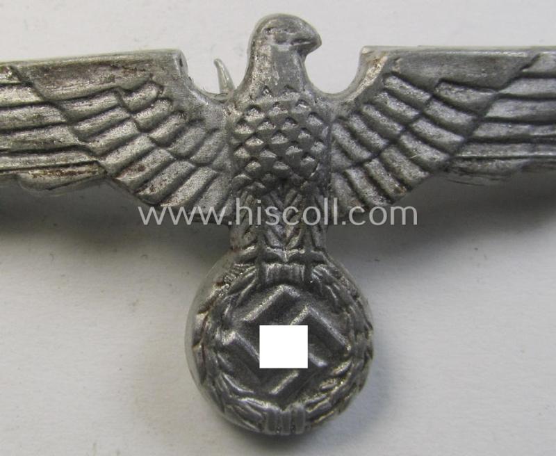 Neat, WH (Heeres) bright-silver-toned (ie. aluminium-based), EM- (ie. NCO- or officers') type visor-cap-eagle being a maker- (ie. 'G.B.'-) marked and/or: '1938'-dated example that comes in a moderately used- ie. once cap-attached-, condition