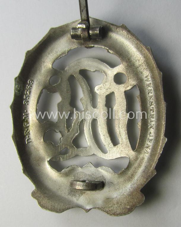 'Virtually mint' example of a: 'Reichssportabzeichen DRL in Silber' (or: DRL sports'-badge in silver) being a just moderately worn- ie. used example that is nicely maker- (ie. 'Wernstein - Jena'-) marked on its back