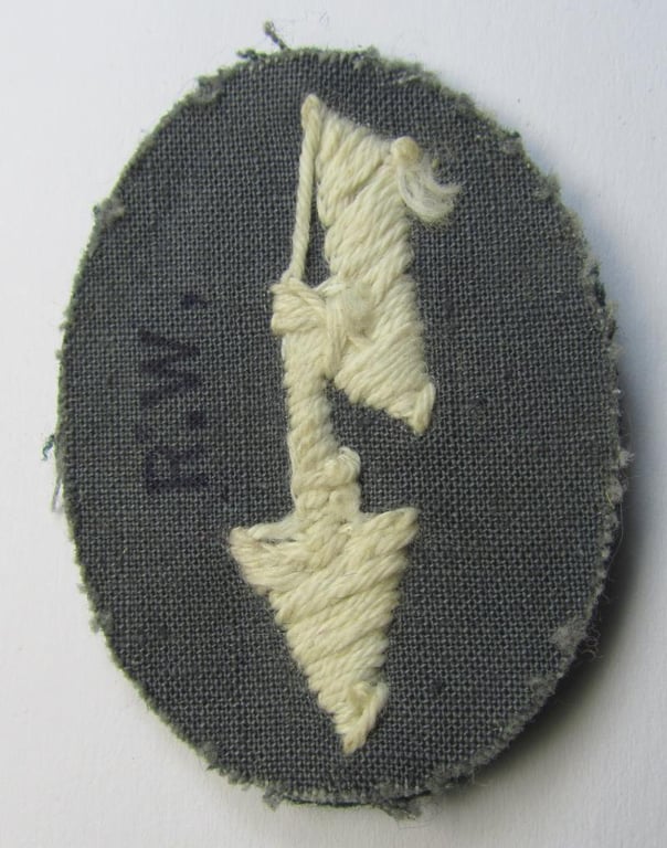 Clearly tunic-removed WH (Heeres) trade- and/or special career insignia ie. hand-embroidered signal-blitz (being a neatly maker-marked example as executed in white) as was intended for a soldier serving within the: 'Infanterie-Truppen'