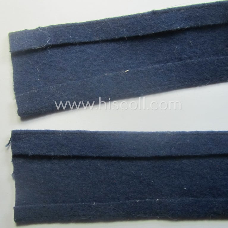 Darker-blue toned, WH (Luftwaffe) cuff-title (ie. 'Ärmelstreifen') entitled: 'Afrika' (being a full-length example that comes in an issued-, used and/or carefully tunic-removed, condition)