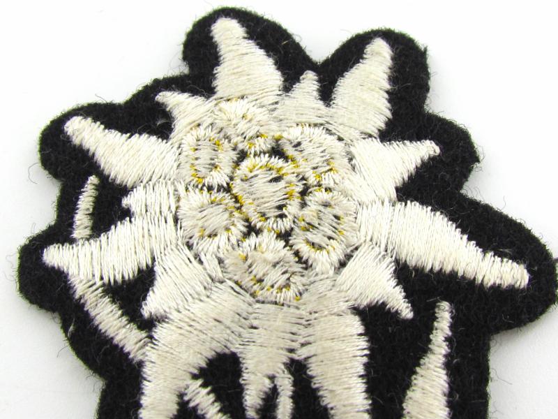 Waffen SS 'Gebirgsjäger' Edelweiss cloth cap badge