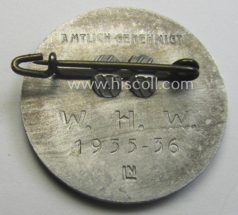 Commemorative, WHW- (ie. 'Winterhilfswerke'-) related 'tinnie' or day-badge being a maker- (ie. 'LN'-) marked example depicting detailed illlustration of 'Adolf Hitler'