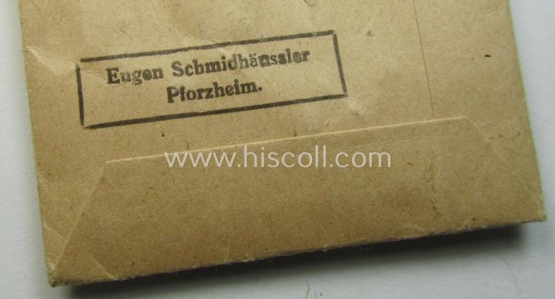 Superb, WH Czech occupation-medal '1 October 1938' and accompanying (mint- & non-confectioned) ribbon (ie. 'Bandabschnitt') that comes stored in its original, carton-based pouch as was produced by the maker: 'Eugen Schmidhäussler'