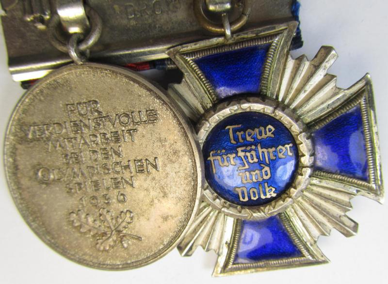 Superb, two-pieced medal-bar (ie. 'Ordenspange') showing resp. an: 'N.S.D.A.P. D.A. in Silber' (ie. '2. Stufe für 15 Jahre t. D.') and a: 'Deutsche Olympia-Erinnerungsmedaille 1936' that both come mounted as a (detachable!) 'Doppelspange'