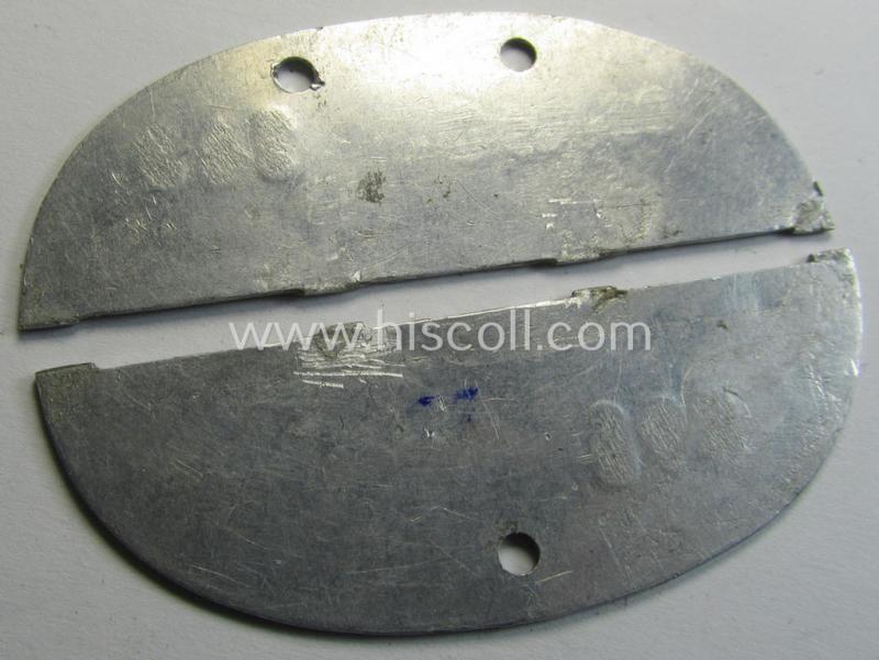 Attractive - albeit broken into 2 parts - example of an aluminium-based 'SS-Verfügungstruppen o. SS-VT'- (ie. 'D'- or: 'Deutschland'-) related ID-disc (ie.: 'Erkennungsmarke') bearing the unit-designation: '15./SS D - SS-Verfügungstruppe'