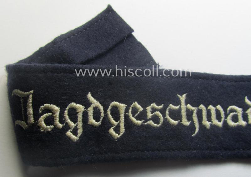 Moderately used, WH (Luftwaffe) cuff-title ie. armband (ie. 'Ärmelstreifen') entitled: 'Jagdgeschwader Udet' that comes in a clearly worn- ie. minimally period-shortened-, condition