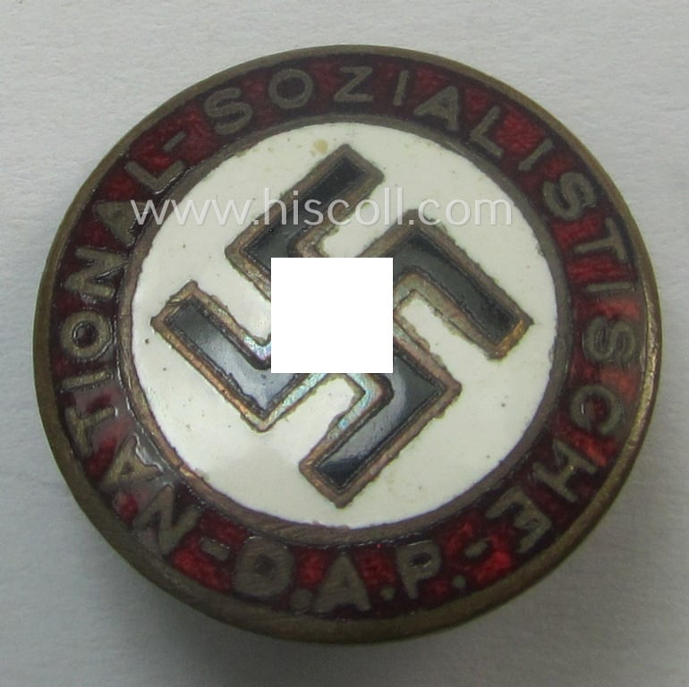 Unusually seen - smaller-sized- and darker-red-coloured! - 'N.S.D.A.P.'-membership-pin- ie. party-badge (or: 'Parteiabzeichen') being a maker- (ie. 'S&L'-) marked example that shows a (dual): 'Ges.Gesch.'-patent-pending-designation