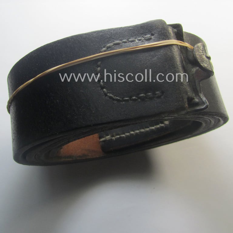 Moderately used, early- (ie. mid-) war-period, black-coloured WH (Heeres, Luftwaffe, Waffen-SS etc.) 'standard-issue'-pattern belt (ie. 'Koppelriemen') being a 105 cms. sized example that shows a (clear) makers'-designation and/or date: '1942'