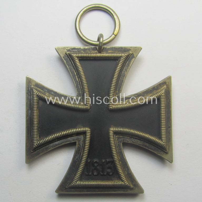 Iron Cross 2nd class (or: 'EK II. Klasse') being a maker- (ie. '120'-) marked example that comes together with its original ribbon (ie. 'Bandabschnitt') as was produced by the (not that often seen!): 'Franz Petzl'-company