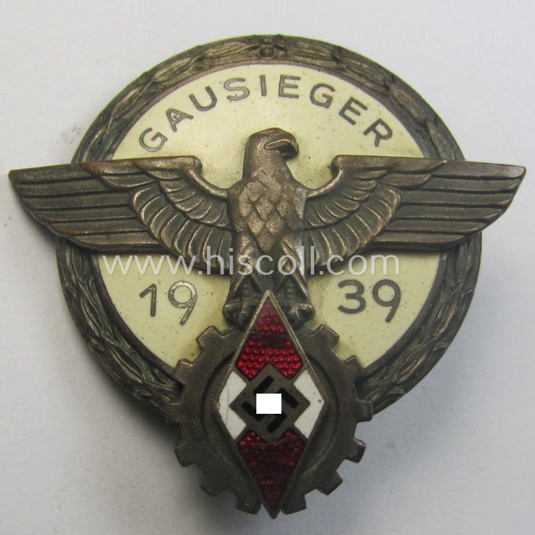 'Buntmetall'-based, 'HJ'- (ie. 'BDM'-) related so-called: 'Reichsberufswettkampf-Siegerabzeichen' (of the 2nd model) entitled: 'Gausieger 1939' and being a neatly maker- (ie.: 'G. Brehmer'-) marked example