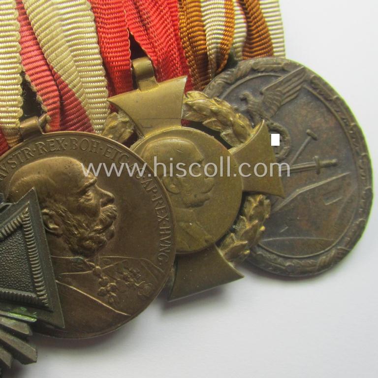 Unusually seen, 8-pieced WWI- (ie. TR- ie. N.S.D.A.P.-) related 'Ordenspange' showing amongst others: an 'N.S.D.A.P-D.A. in Bronze' (ie. '3. Stf. für 10 Jahre t.D.') and various WWI-period Austrian-(Hungarian) awards