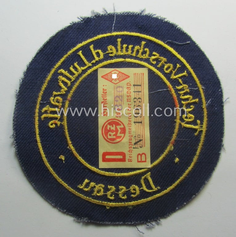 HJ- (ie. 'Flieger-HJ') specialist-armbadge (or: 'Schulabzeichen') depicting the text: 'Techn. Vorschule d. Luftwaffe - 3 - Dessau' (still retaining its 'RzM'-etiket!)