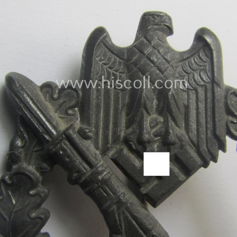 'Infanterie Sturmabzeichen in Silber' (or: silber-class infantry assault-badge ie. IAB) being a non-maker-marked, zinc- (ie. 'Feinzink'-) based example as was (I deem) produced by the: 'S.H.u.C.o.'-company