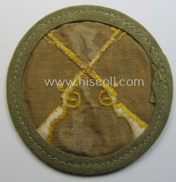 WH (Heeres) 'tropical'-issued, trade- and/or special-career insignia (ie. machine-embroidered 'Laufbahn- o. Tätigkeitsabzeichen') as was intended for an army: 'Waffenmeister' (or weapon-equipment NCO)