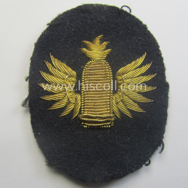 Fully matching set ie. pair of WH (Kriegsmarine) hand-embroidered career- ie. specialist-armbadges, as executed on dark-blue-coloured wool as intended for usage by an officer serving within a: 'Küstenartillerie'-unit