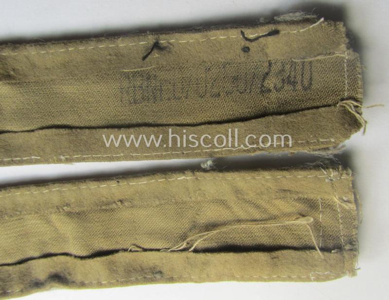 WH cuff-title (ie. 'Ärmelstreifen') entitled: 'Afrika' (being an example that bears a printed 'RbN.'-numeral ('RBN.0/0250/2340') and that comes in an issued, clearly worn- and/or most certainly once tunic-attached, condition)