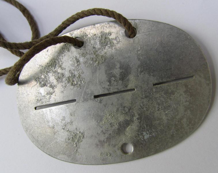 Neat, aluminium-based, WH (Luftwaffe or Heeres) 'Pioniere'-/'Bau' (ie. engineers-) related ID-disc, bearing a stamped unit-inscription- ie. designation that reads: '3./Bau.6' - nice, albeit clearly used ie. worn-, condition!