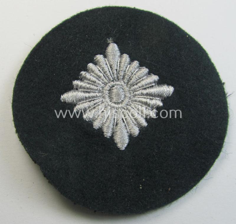 WH (Heeres) rank-insignia (ie. silver-grey-coloured and machine-embroidered 'roundel') as intended to identify a soldier with the rank of: 'Oberschütze', 'Oberjäger' etc. that comes in a 'virtually mint- ie. unissued', condition