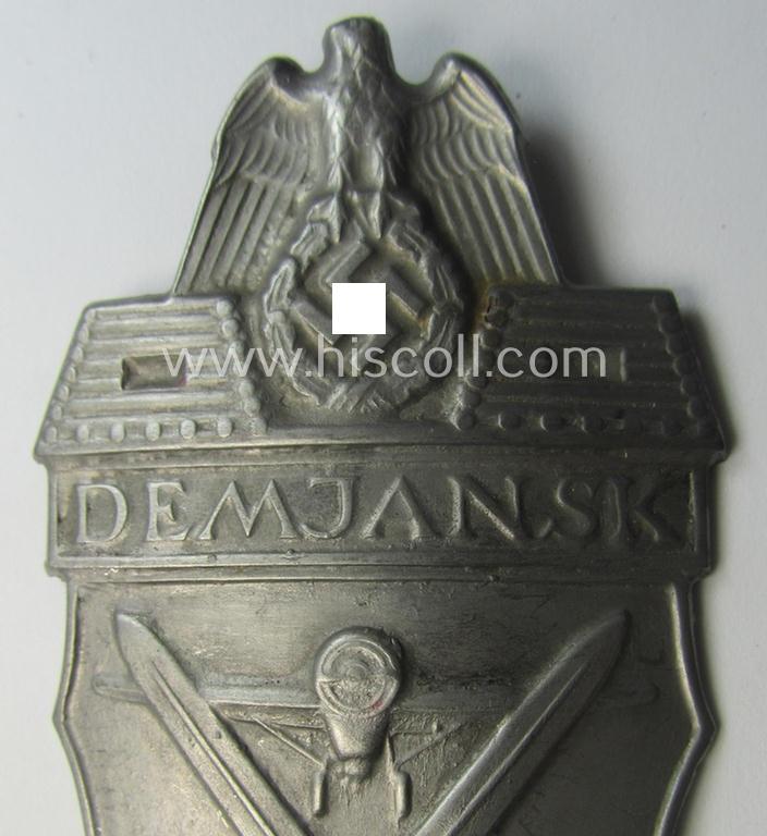 Nicely preserved - albeit regrettably incomplete ie. relic! - example of a WH (Heeres ie. Waffen-SS) 'Demjansk'-campaign-shield as executed in typical magnetic, so-called: 'Eisenblech'