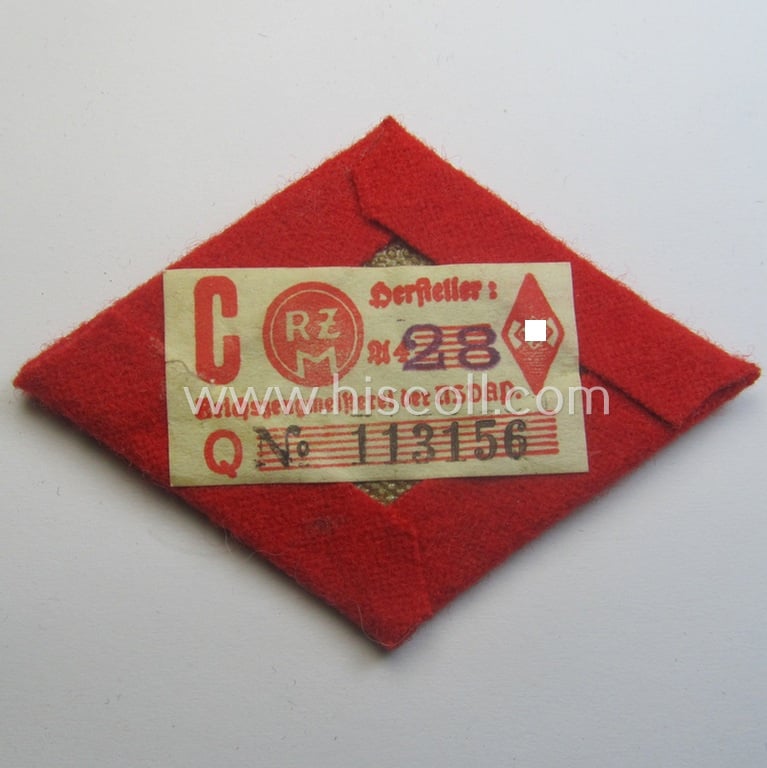 Superb - and rarely found! - neatly hand-embroidered, HJ (ie. 'Hitlerjugend') arm-badge as was specifically intended for usage by an: 'HJ-Adjutant' (still retaining its 'RzM'-etiket)