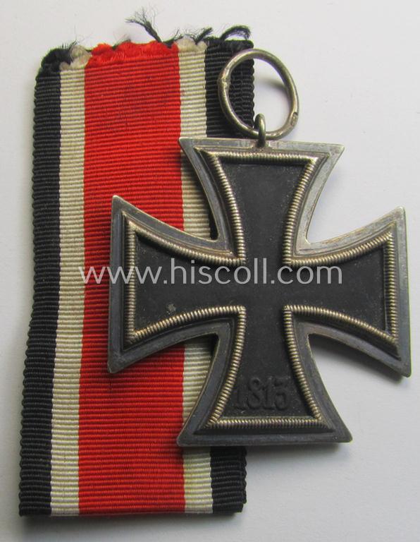 'Eisernes Kreuz II. Klasse' being a maker- (ie. '44'-) marked example that comes together with its (mint- and full length) ribbon (ie. 'Bandabschnitt') as was produced by the maker (ie. 'Hersteller'): 'Jakob Bengel - Oberstein'