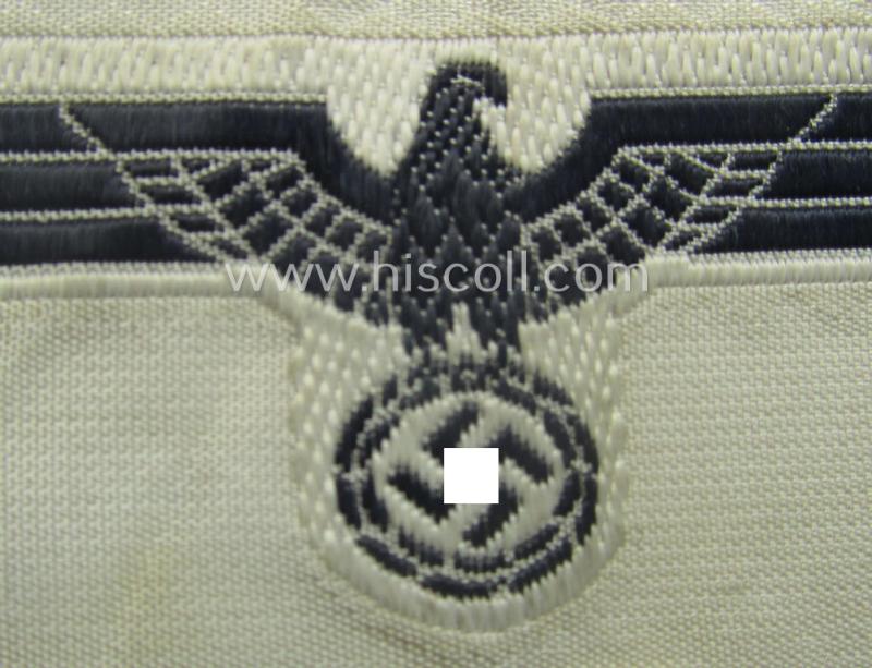 WH (KM) EM- (ie. NCO-) type side-cap-eagle (ie. 'Schiffchenadler für Mannschaften u. Uffz. der KM') as executed in the 'BeVo'-weave-pattern on a white-coloured background as was specifically intended for usage on the various white-coloured side-c...