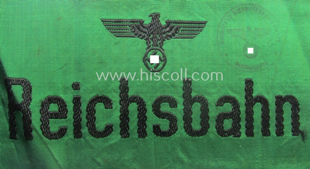 DRB- (ie. 'Deutsche Reichsbahn'-) related armband entitled: 'Reichsbahn' being of the 'entirely-woven'-type onto (typical) linnen-based cloth in a technique similar to the 'BeVo'-weave pattern