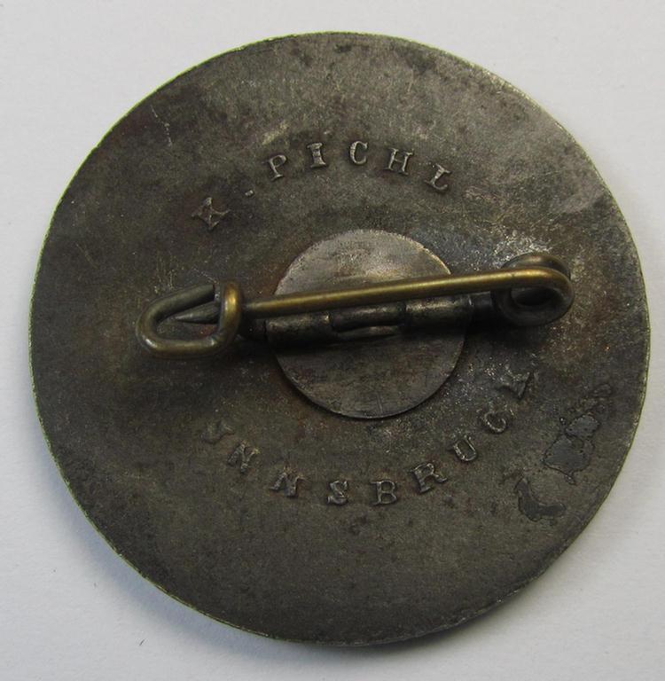 Attractive, WHW- (ie. 'Winterhilfswerke'-) related day-badge (ie. 'tinnie') or: 'Veranstaltungsabzeichen des Standschützenverbandes Tirol-Vorarlberg' depicting the text: 'W.H.W. Opferschiessen 1942/43'