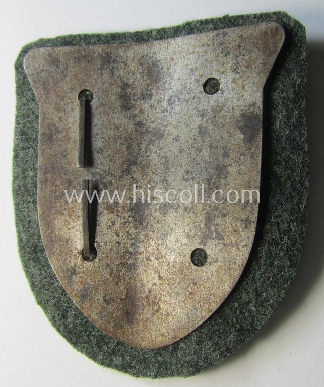 Attractive, WH (Heeres o. Waffen-SS) 'Krim'-campaign-shield that comes mounted onto its original, field-grey-coloured 'backing' and that comes in an issued-, minimally worn and/or (I deem) carefully tunic-removed-, condition