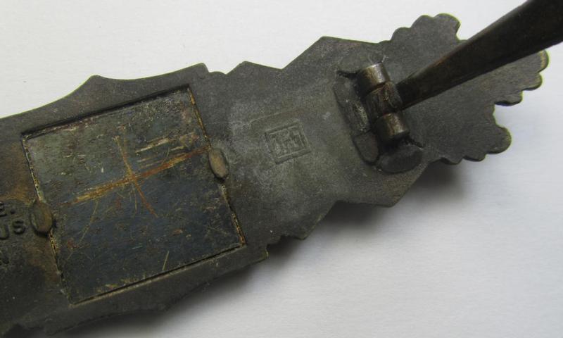 'Nahkampfspange in Bronze' (or: bronze-class close-combat clasp ie. CCC) being a neatly maker-marked- and/or minimally converse-shaped specimen as was produced by the: 'JFS'- (ie. 'Joseph Feix u. Söhne'-) company