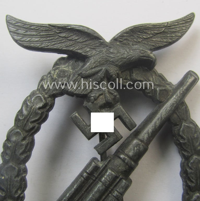 Later-war period- and/or: zinc- (ie. 'Feinzink'-) based- example of a maker- (ie. 'WH'-) marked, WH (Luftwaffe) 'Flakkampfabzeichen' (or: airforce anti-aircraft badge), as was produced by the desirable: 'Wilhelm Hobacher'-company