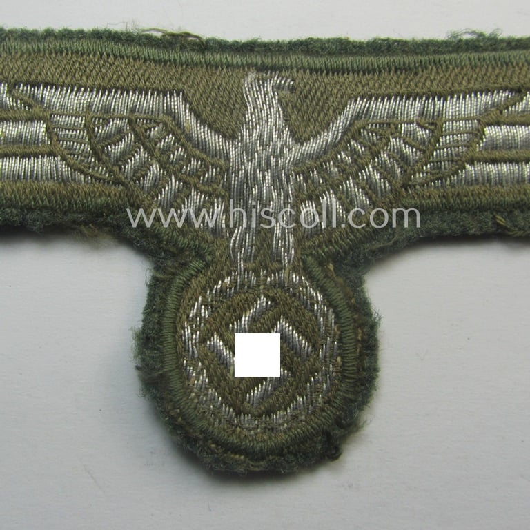 WH (Heeres) breast-eagle as executed in 'BeVo'-type-, so-called: 'flat-wire'-weave-pattern and pre-mounted on field-grey-coloured wool as was specifically intended for usage by soldiers (ie. NCOs) on their dress-tunics (ie. 'Waffenröcke')