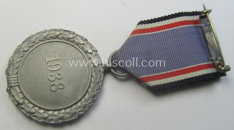 Light-weight (ie. typical aluminium-based) medal as was intended for air-raid wardens 2nd. class (or: 'Luftschutz-Ehrenzeichen 2. Stufe') that comes stored in its period, dove-grey-coloured etui