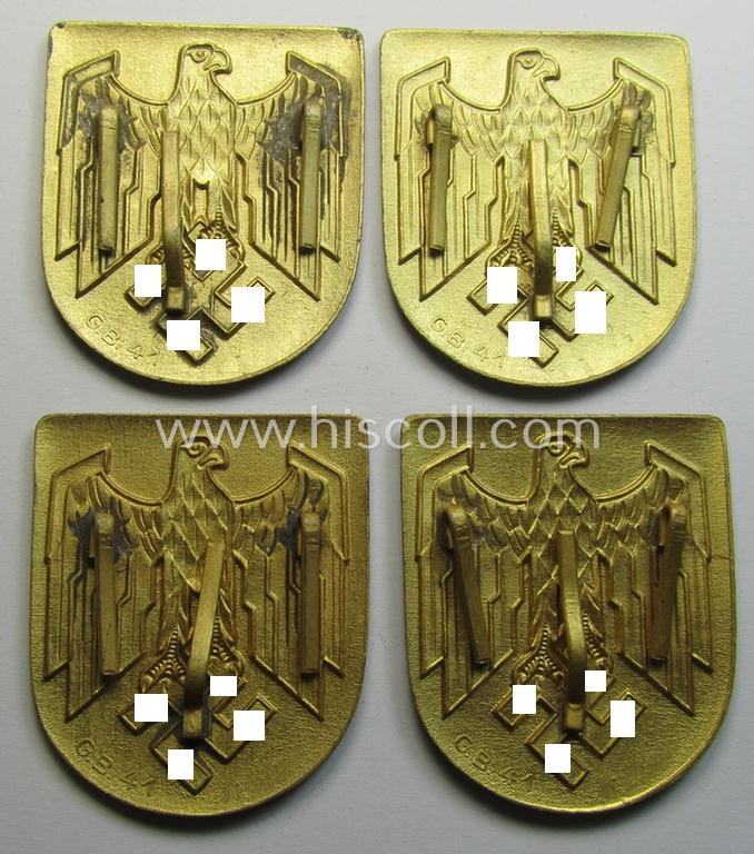 Superb, WH (KM) tropical- (ie. 'DAK'- or: 'Deutsches Afrikakorps'-) related- and/or zinc-based, eagle-'pith-helmet'-shield being a maker- (ie. 'G.B.-41'-) marked example that comes in a very nice- (ie. 'virtually mint- ie. unissued'-), cond...