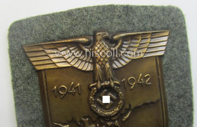 WH (Heeres ie. Waffen-SS) 'Krim'-campaign-shield (by the maker: 'Friedrich Orth') that comes stored in its period (and rarely seen!) 'Zellstoff'-based pouch and that comes in a probably issued- (albeit still 'virtually mint'-), condition