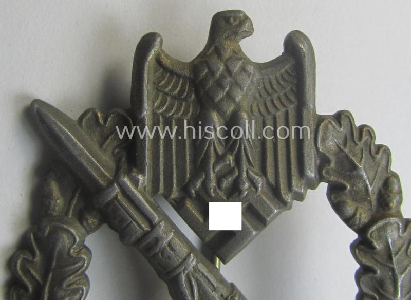 'Infanterie Sturmabzeichen in Bronze' (or: bronze-class infantry assault-badge ie. IAB) being a maker- (ie. 'ÜÜ'- ie. 'E.F. Wiedmann') marked so-called: 'Lily Pad-hinge'-example as was executed in zinc-based metal