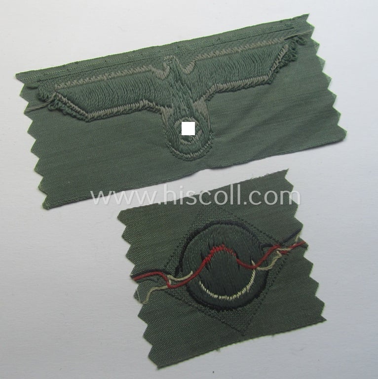 Early- (ie. mid-) war-period, WH (Heeres) cap-eagle & cocarde-set (ie. 'Schiffchenmützen-Adler u. Kokarde-Satz für Mannschaften u. Uffz.') being a 'virtually mint' set as executed in bluish-grey-coloured linnen on a field-grey-coloured background