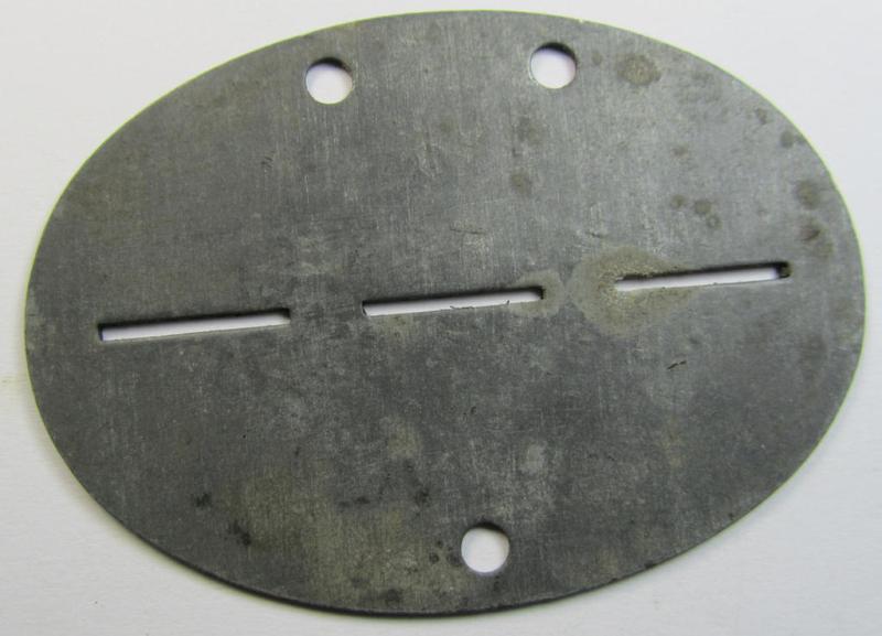 Zinc-based, WH (Luftwaffe) ie. 'LW-Flak-Artillerie'-related ID-disc (ie. 'Erkennungsmarke') bearing the stamped unit-designation that simply reads: '8./Lei.F.E.A. 92' and that comes as issued- and/or worn
