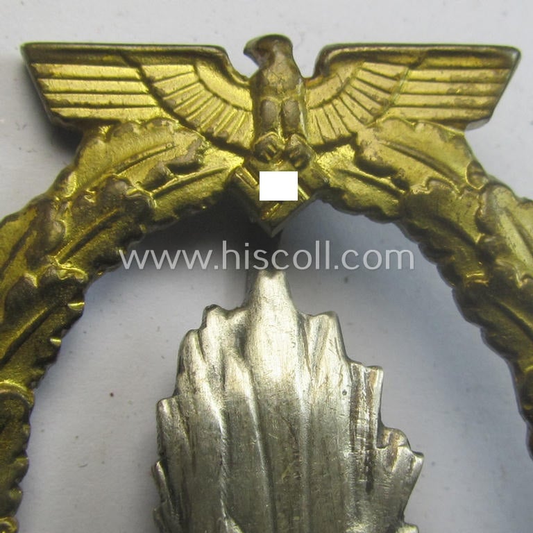WH (Kriegsmarine) 'Kriegsabzeichen für Minensuch-, U-Boot-Jagd und Sicherungs-Verbände' (being a very detailed and clearly maker-marked example as executed in multi-coloured 'Buntmetall' as produced by the: 'Schwerin - Berlin'-company)
