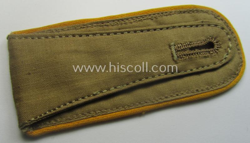 Single, WH (Luftwaffe) tropical-issued, EM-type-shoulderstrap as executed in beige-coloured linnen (as was specifically intended for usage on the tropical-shirts ie. tunics) as was intended for a: 'Soldat der Flieger- o. Fallschirmjäger-Trpn.'