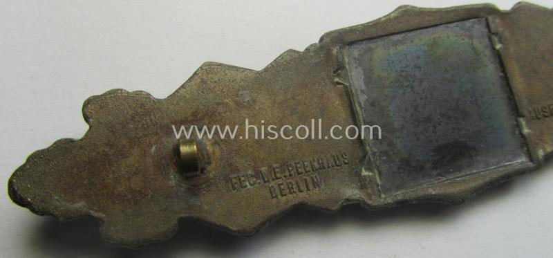 'Nahkampfspange in Bronze' (or: bronze-class close-combat clasp ie. CCC) being a neatly maker-marked- and/or minimally converse-shaped specimen by the maker- (ie. 'Hersteller') 'C.E. Juncker - Berlin'