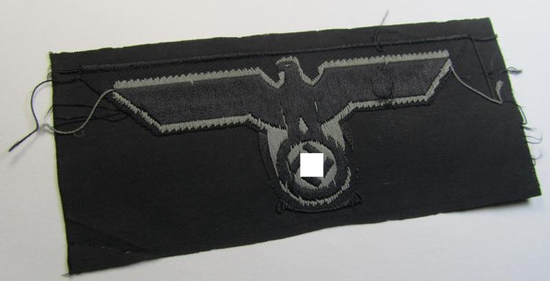 Later- (ie. mid-war-) period, WH (Heeres) 'Panzer'-type breast-eagle (ie. 'Brustadler für Panzertruppen') being a 'virtually mint- ie. unissued' example as executed in bluish-grey-coloured linnen on a black-coloured background