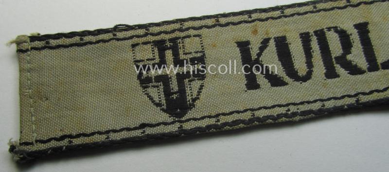 Full-length example of a WH (Heeres ie. Kriegsmarine) cuff-title- ie. armband (ie. 'Ärmelstreifen') entitled: 'Kurland' that comes in an overall very nice- (albeit clearly used- ie. tunic-removed-), condition