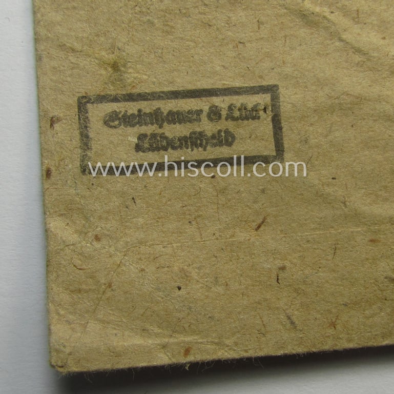'Verwundeten-Abzeichen in Schwarz' being a maker- (ie. '4'-) marked example by the: 'Steinhauer & Lück'-company that came stored in its (scarcely seen!) period pouch