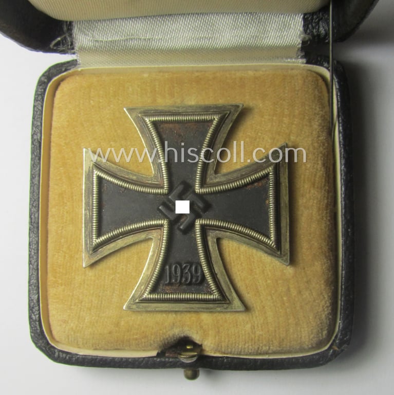 'Eisernes Kreuz 1. Kl.' (or: Iron Cross 1st class) being a (typical) maker- (ie. '7'-) marked example as was produced by the maker (ie. 'Hersteller'): 'Paul Meybauer' and that comes in its original etui as issued