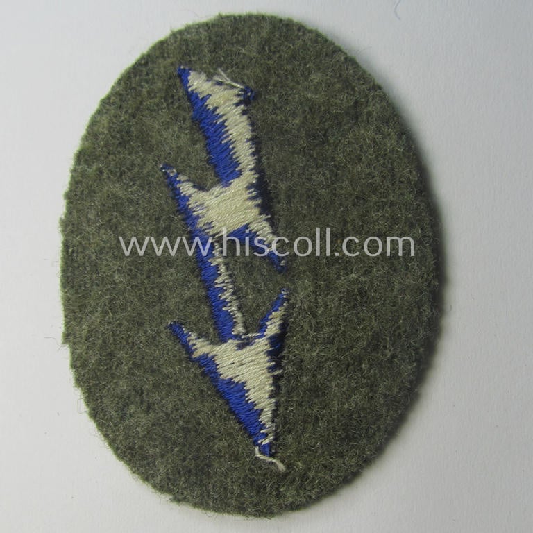 WH (Heeres) trade- and/or special-career-insignia (ie. machine-embroidered 'signal-blitz') example as executed in darker-blue-coloured linnen as was specifically intended for a soldier within the: 'Sanitäts-Trpn.'