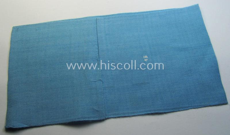 Attractive, linnen-based- and/or light-blue-coloured armband (ie. 'Armbinde') depicting an interwoven capital 'M'-character as was presumably intended for staff-members of the German RLB (ie. 'Reichsluftschutz-Bund')